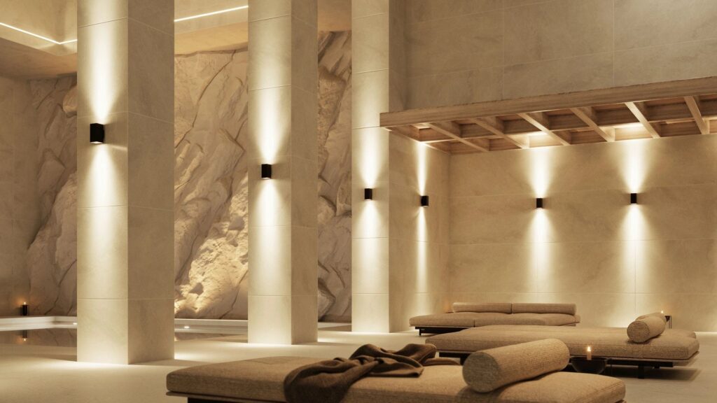 Spa con le applique Beneito Faure Sunset sulla parete in pietra