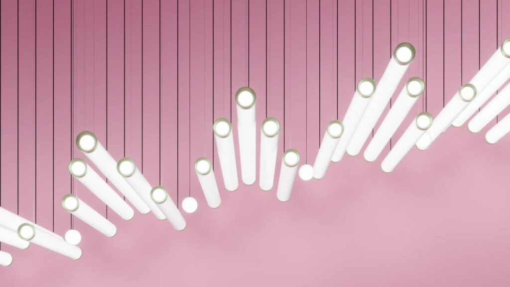 Cilindri di luce Prolicht Ghost inclinati su fondo rosa